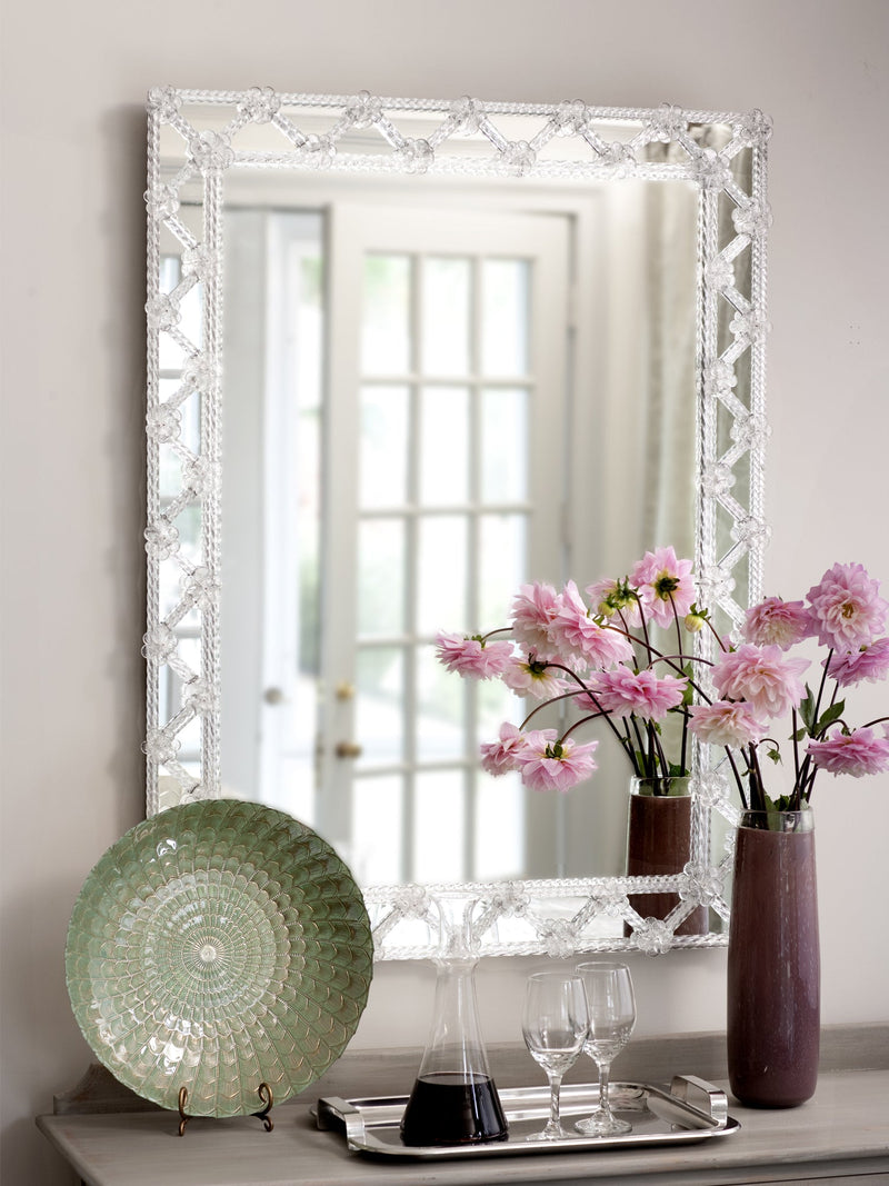Decorative Crafts handmade Italian beaded wall mirror styled on a console table with floral arrangements and decorative accents.