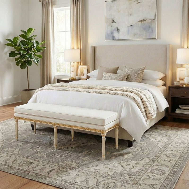 Decorative Crafts handmade Italian upholstered bench with carved gilt details in an elegant bedroom.
