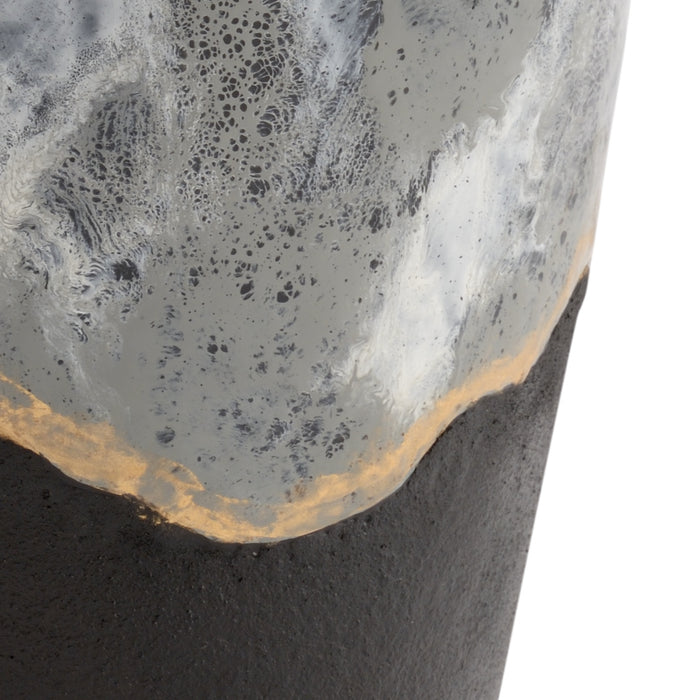 Close-up of a concrete surface with a textured top and smooth sides.
