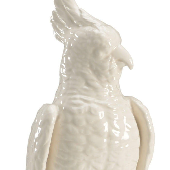 White ceramic parrot sculpture on a white background