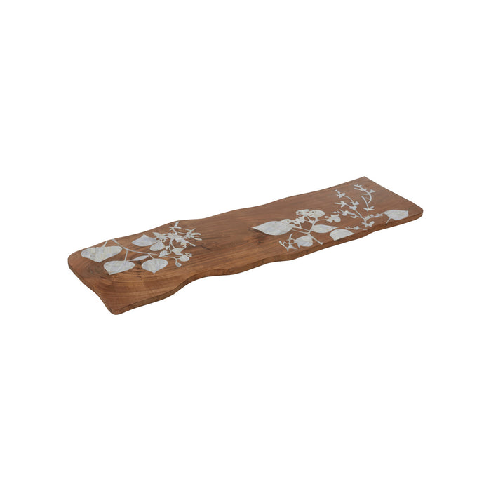 Wooden serving board with white floral patterns on a white background