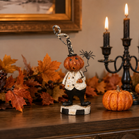 Design Shop 6 Inch Resin Pumpkin Man Holding Black Spider