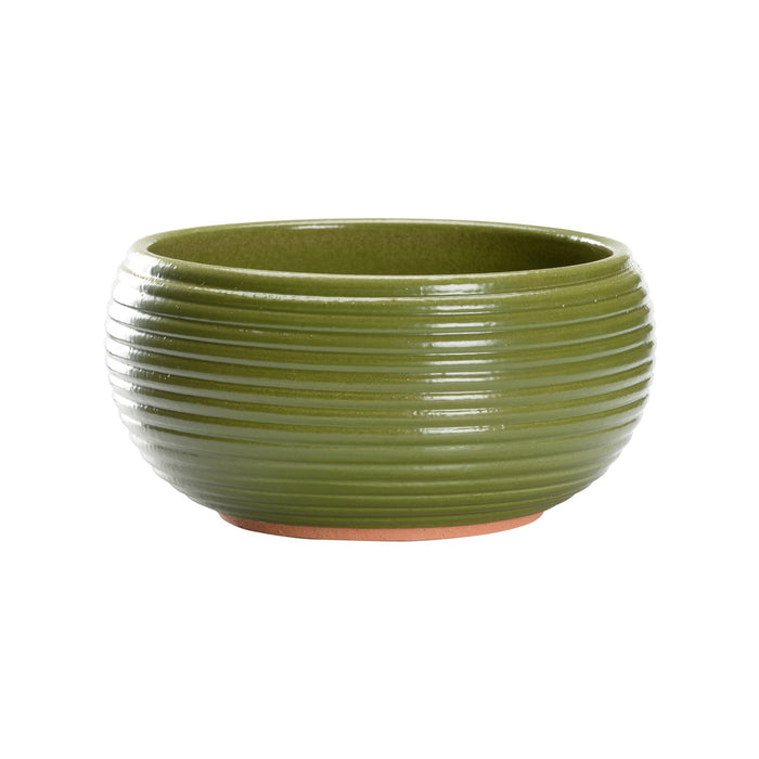 Green ribbed ceramic pot on a white background