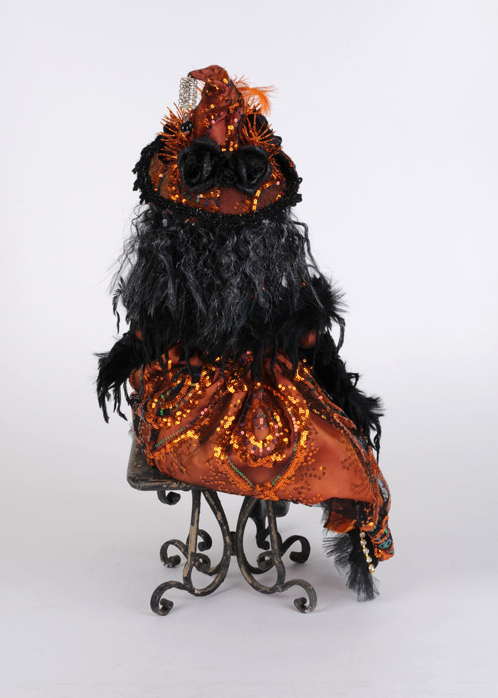 Decorative Halloween figure with black and orange feathers on a white background