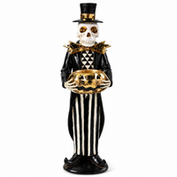 Design Shop 13 Inch Black and Gold Skeleton Holding Gold Jack O Lantern Pumpkin