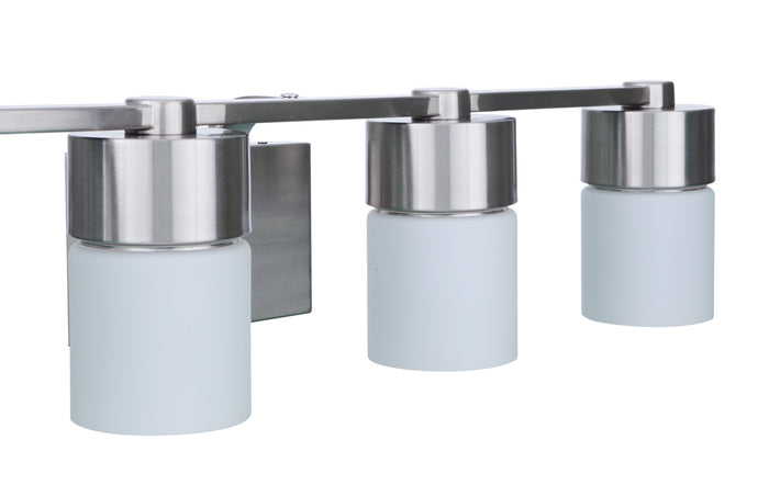 Craftmade Four Light Vanity from the District collection in Brushed Polished Nickel finish
