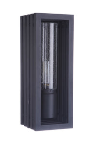 A textured black outdoor wall mount lantern with a clear-seeded glass shade.