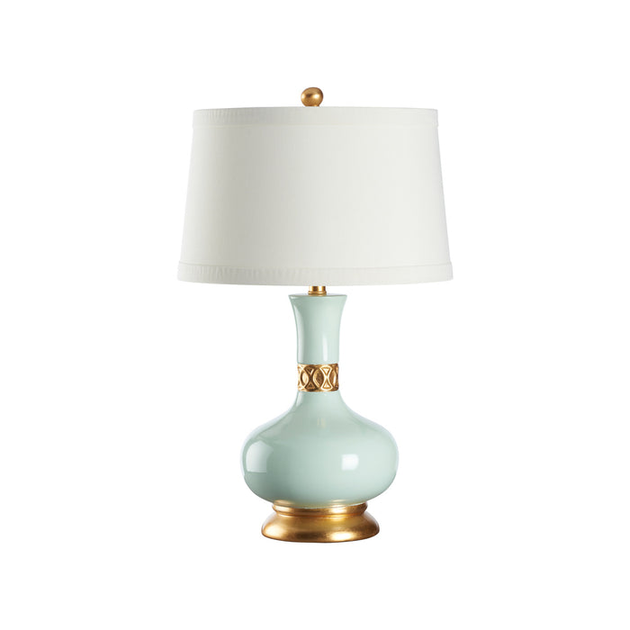 Table lamp with a light blue ceramic base and gold accents on a white background