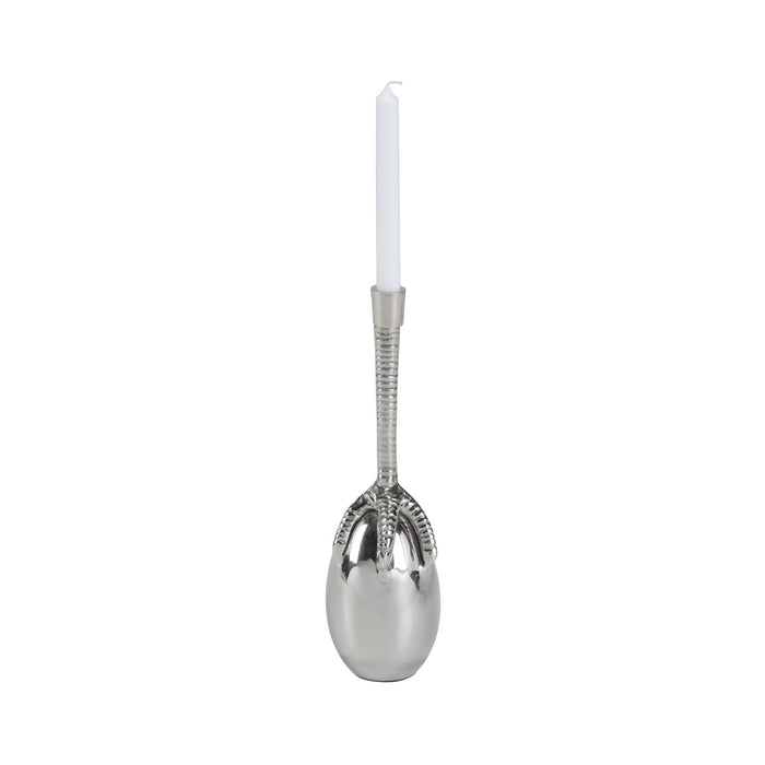 Silver spoon with a candle on a white background