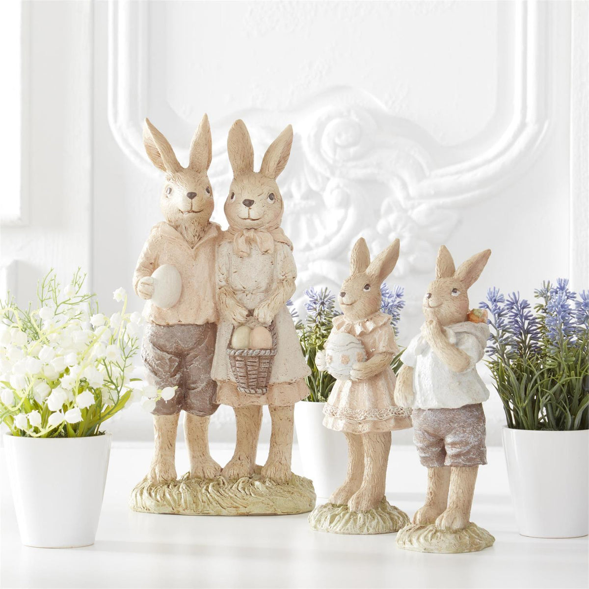 Design Shop Assorted Resin Boy and Girl Bunnies w/Egg and Backpack. Set of 2.
