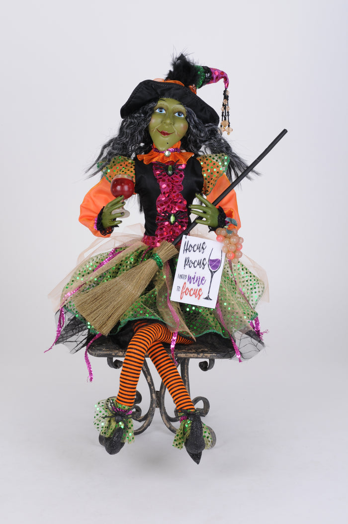Halloween witch doll with broom and sign on a white background