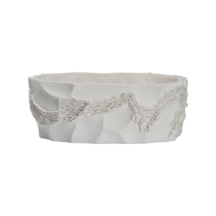 White ceramic planter with textured design on a white background