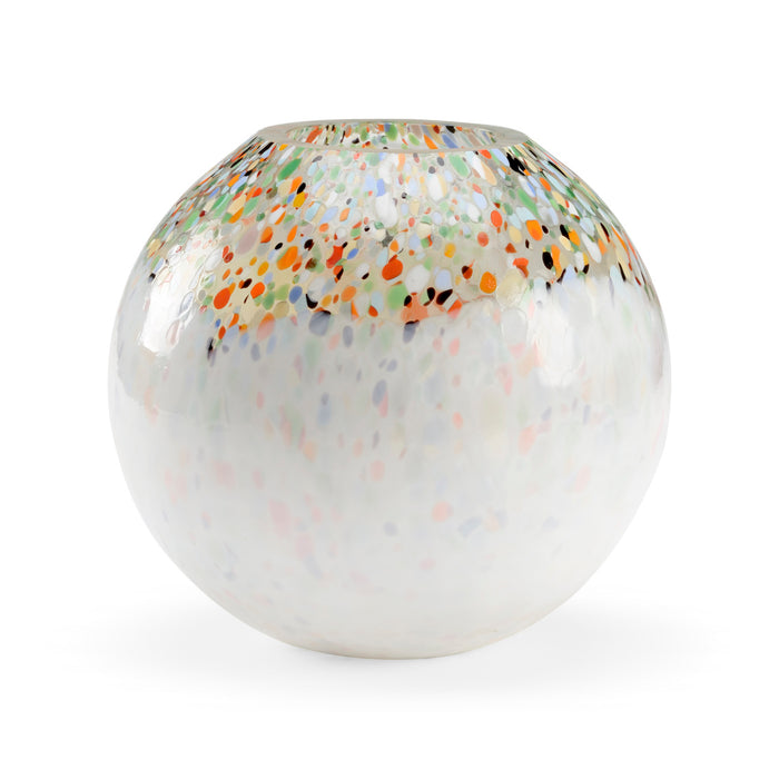Decorative glass ball with multicolored speckles on a white background