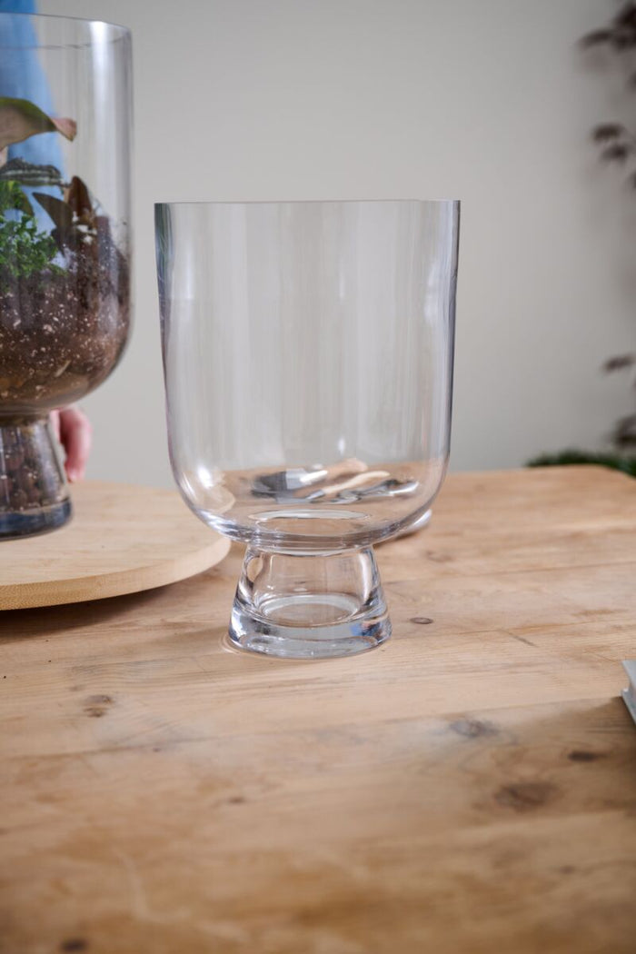 Clear glass on a wooden table with a blurred background