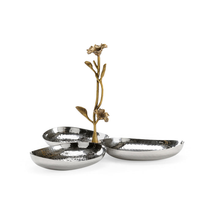 Decorative metal dish with floral design on a white background