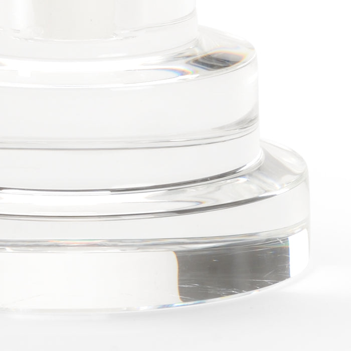 Close-up of a clear glass container with a white background