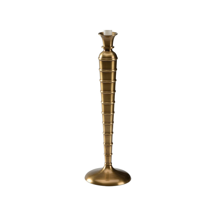 Brass candle holder on a white background