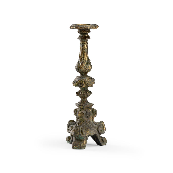 Decorative bronze candlestick on a white background