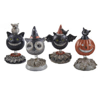 Set of Halloween-themed bobblehead figures on a white background