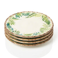 Round plate with green leaf pattern on a white background