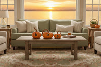 Three small pumpkins with letters spelling 'BOO' on a white background