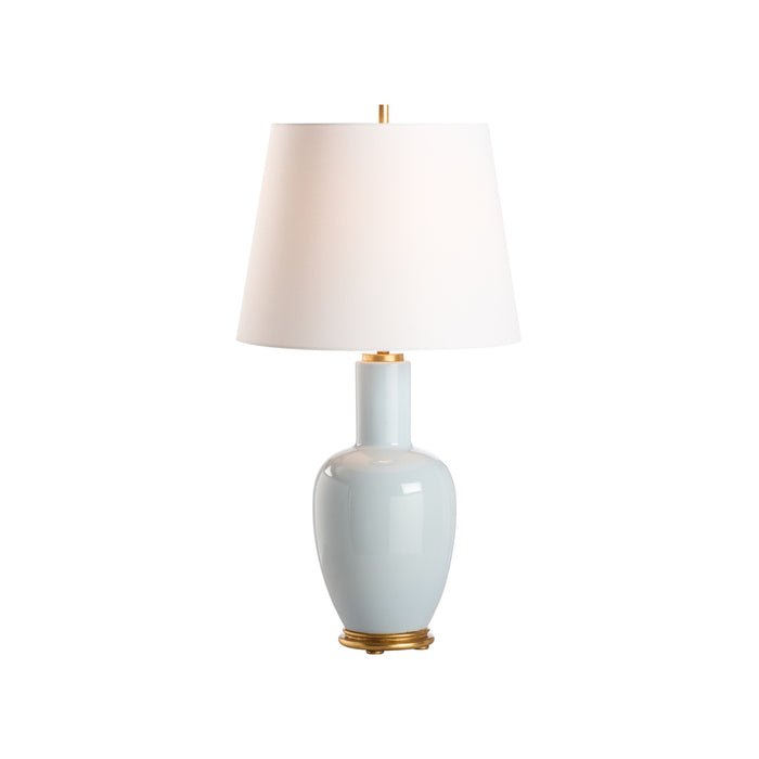 Table lamp with a light blue ceramic base and white shade on a white background