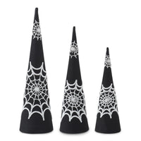 Three black cone-shaped decorations with white spider web patterns on a white background