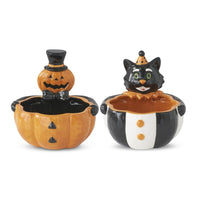 Halloween-themed salt and pepper shakers shaped like a pumpkin and a black cat on a white background.