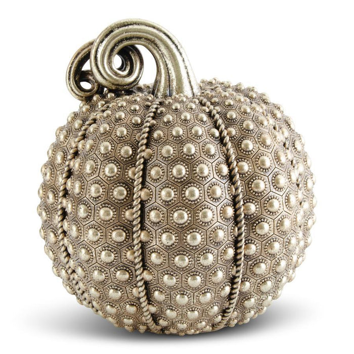 Decorative pumpkin with textured surface and spiral design on a white background