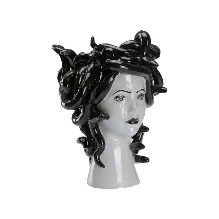 Vase shaped like a woman's head with black hair on a white background