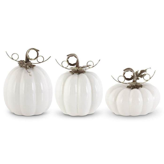 Three white decorative pumpkins with brown stems on a white background