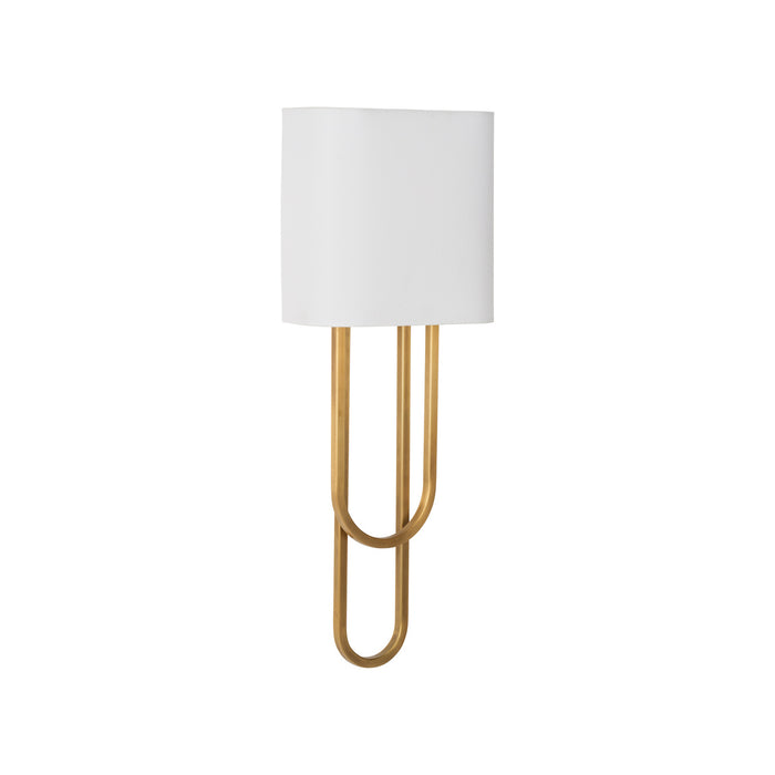Tall lamp with gold base and white shade on a white background
