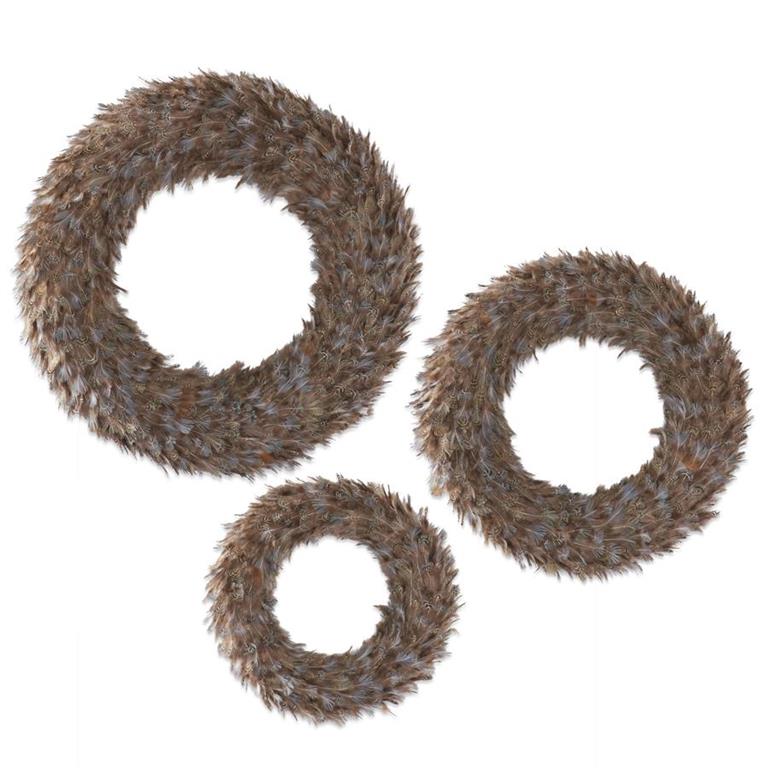 Three brown wreaths of different sizes on a white background