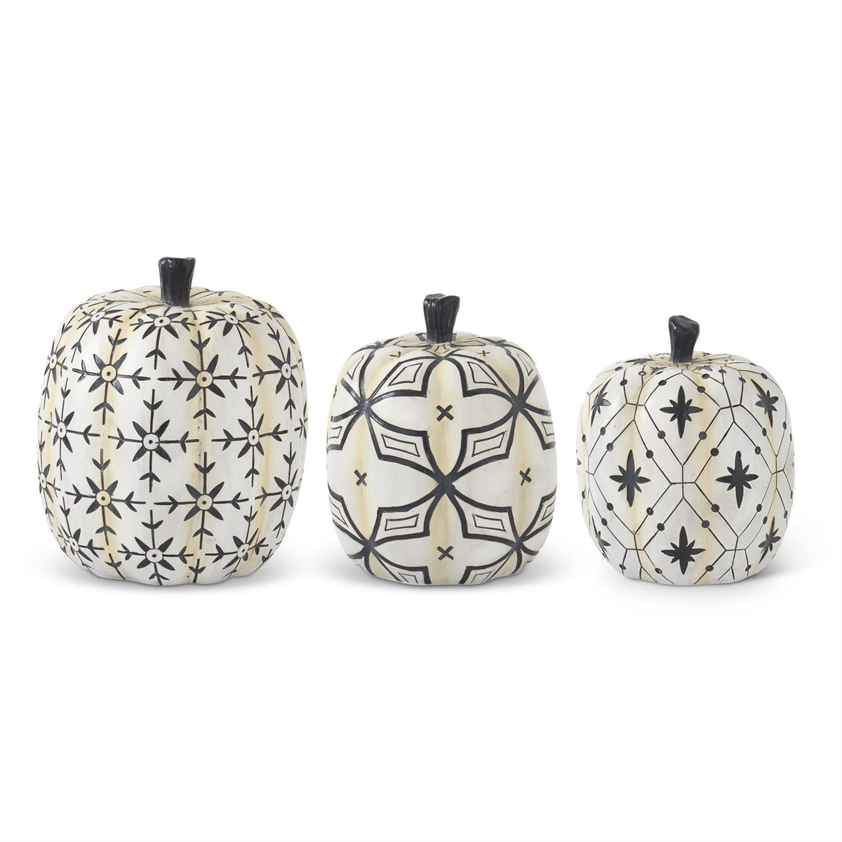 Three decorative pumpkins with black geometric patterns on a white background