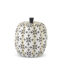 Decorative pumpkin with black geometric pattern on a white background