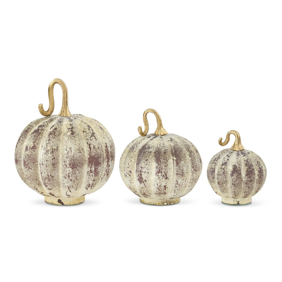 Three decorative pumpkins with distressed finish on a white background