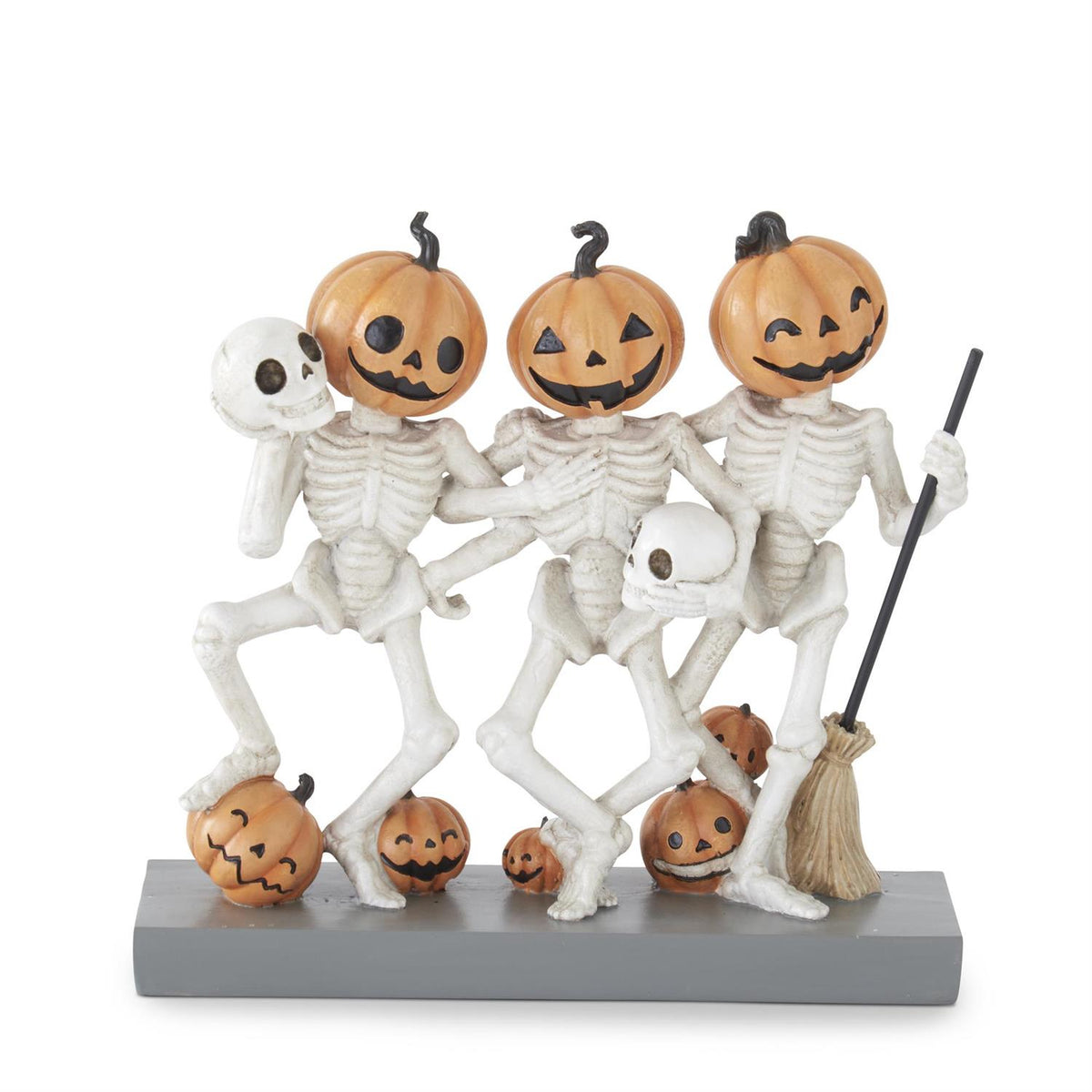 Halloween-themed figurine with skeletons and pumpkins on a white background