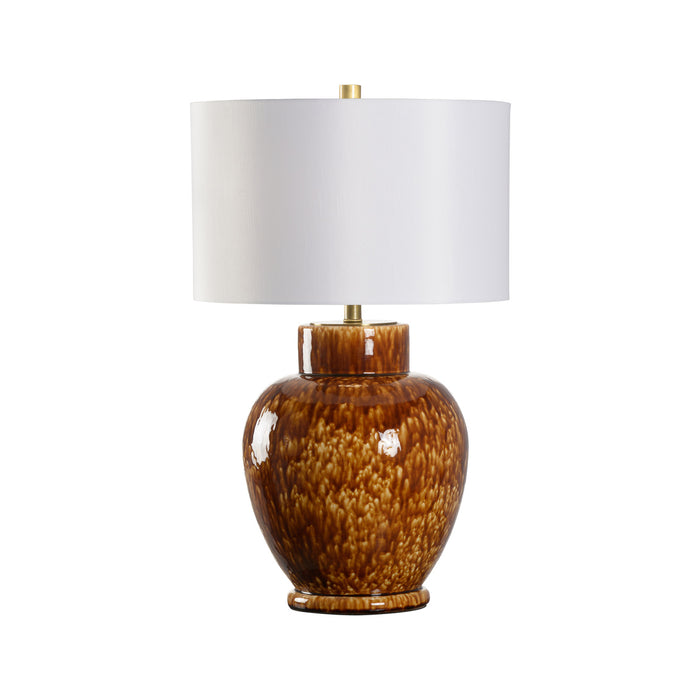 Table lamp with brown ceramic base and white shade on a white background