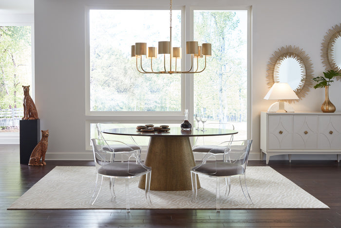 Modern dining room with a wooden table, chairs, and decorative elements.