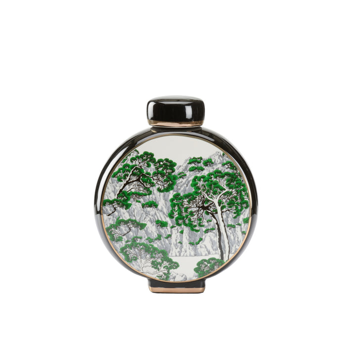 Round decorative item with tree design on a white background