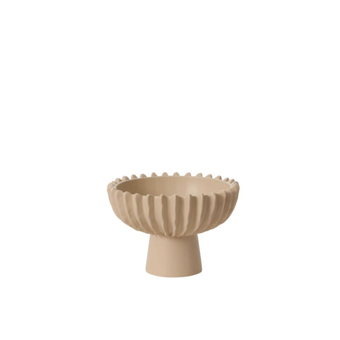 Beige ceramic bowl with textured design on a white background