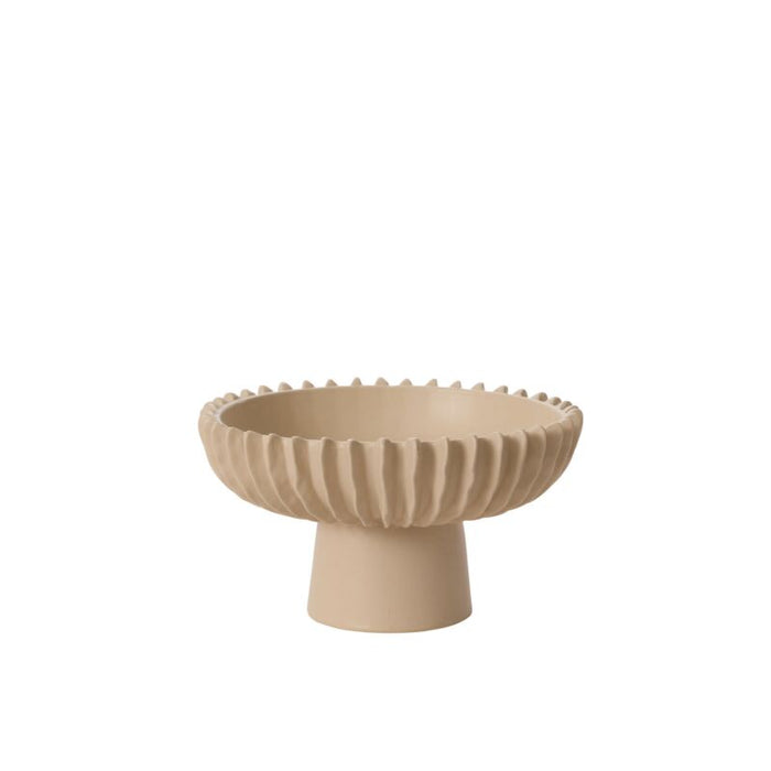 Beige ceramic bowl with textured design on a white background