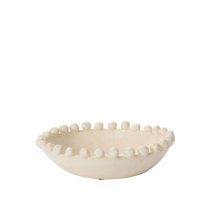 Decorative bowl with bead-like embellishments on a white background