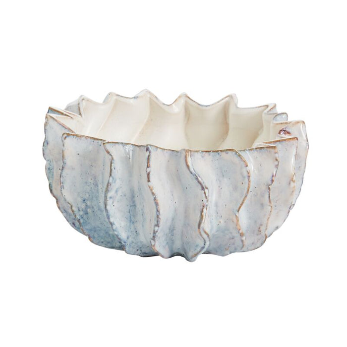 Ceramic bowl with textured surface on a white background