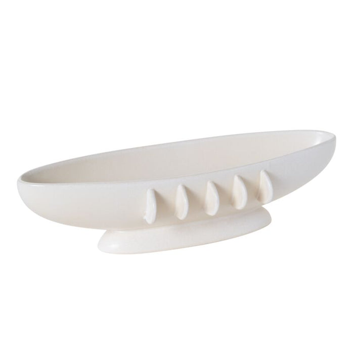 White ceramic bowl with decorative elements on a white background