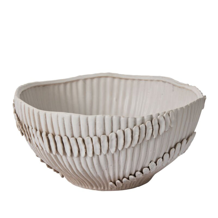 Decorative ceramic bowl with textured design on a white background