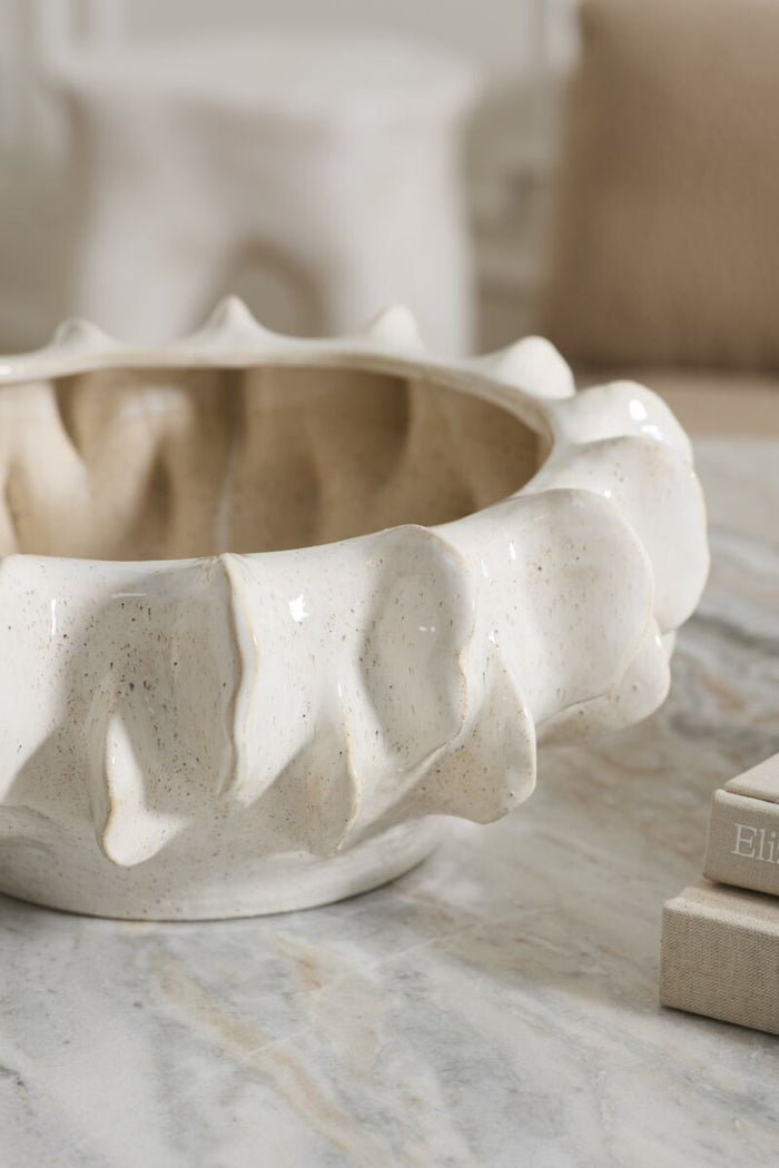 Ceramic bowl with textured design on a marble surface