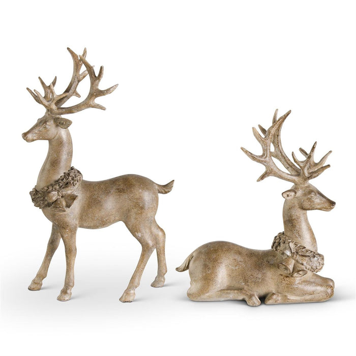 Two decorative deer statues with antlers on a white background