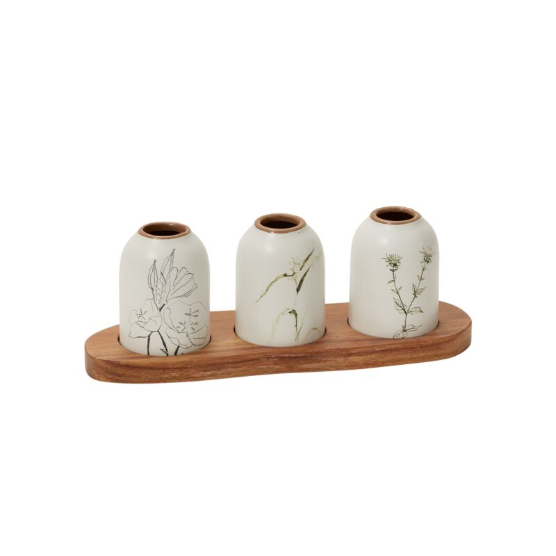 Set of three ceramic jars with wooden lid on a wooden tray against a white background