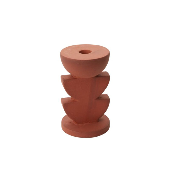 A terracotta candle holder with a stacked half-moon design.